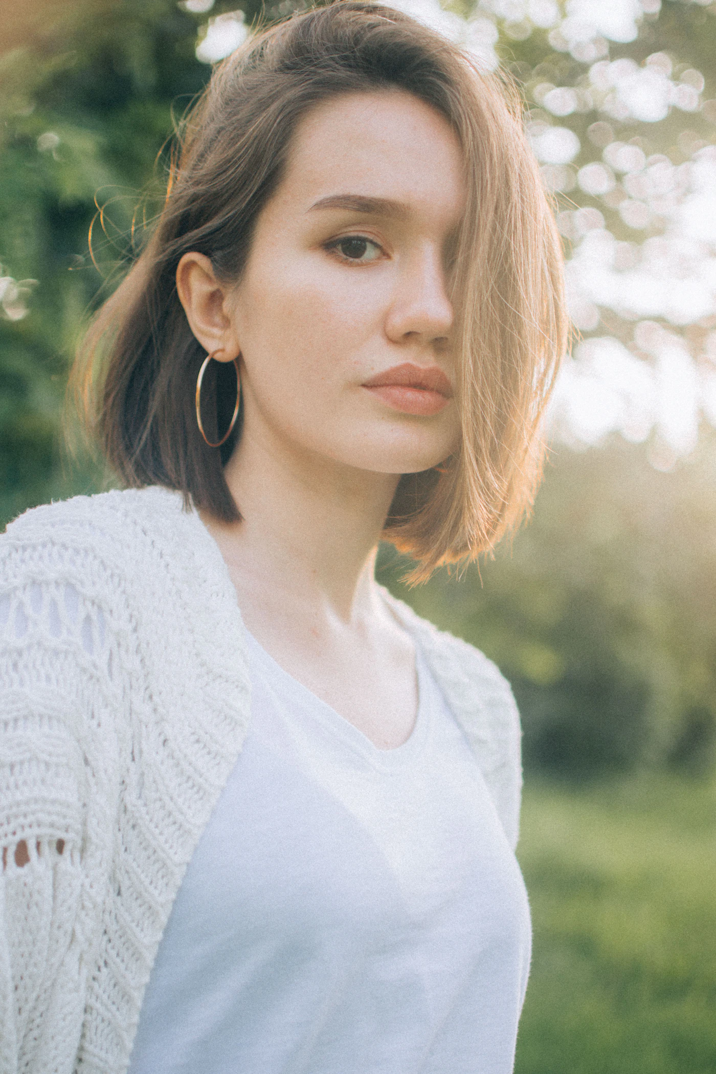 Woman wearing white cardigan